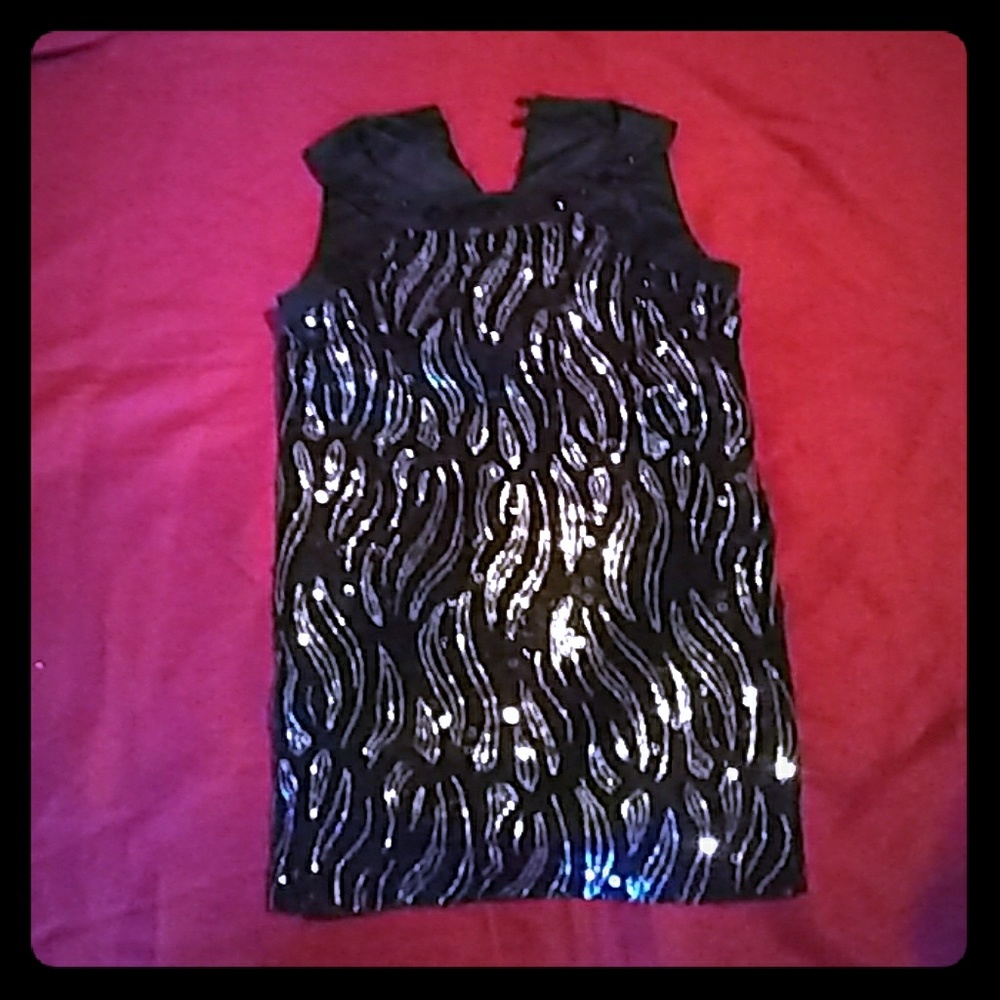 A black and silver short cut sparkly dress